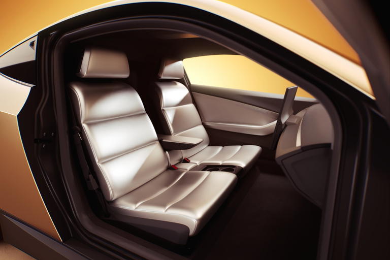Interior trasero del Tesla Robotaxi Model Q, dise&ntilde;o futurista y minimalista.