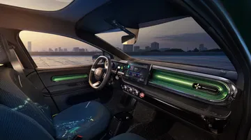 Interior del Renault Twingo 2025, con colores vibrantes y un diseño moderno.