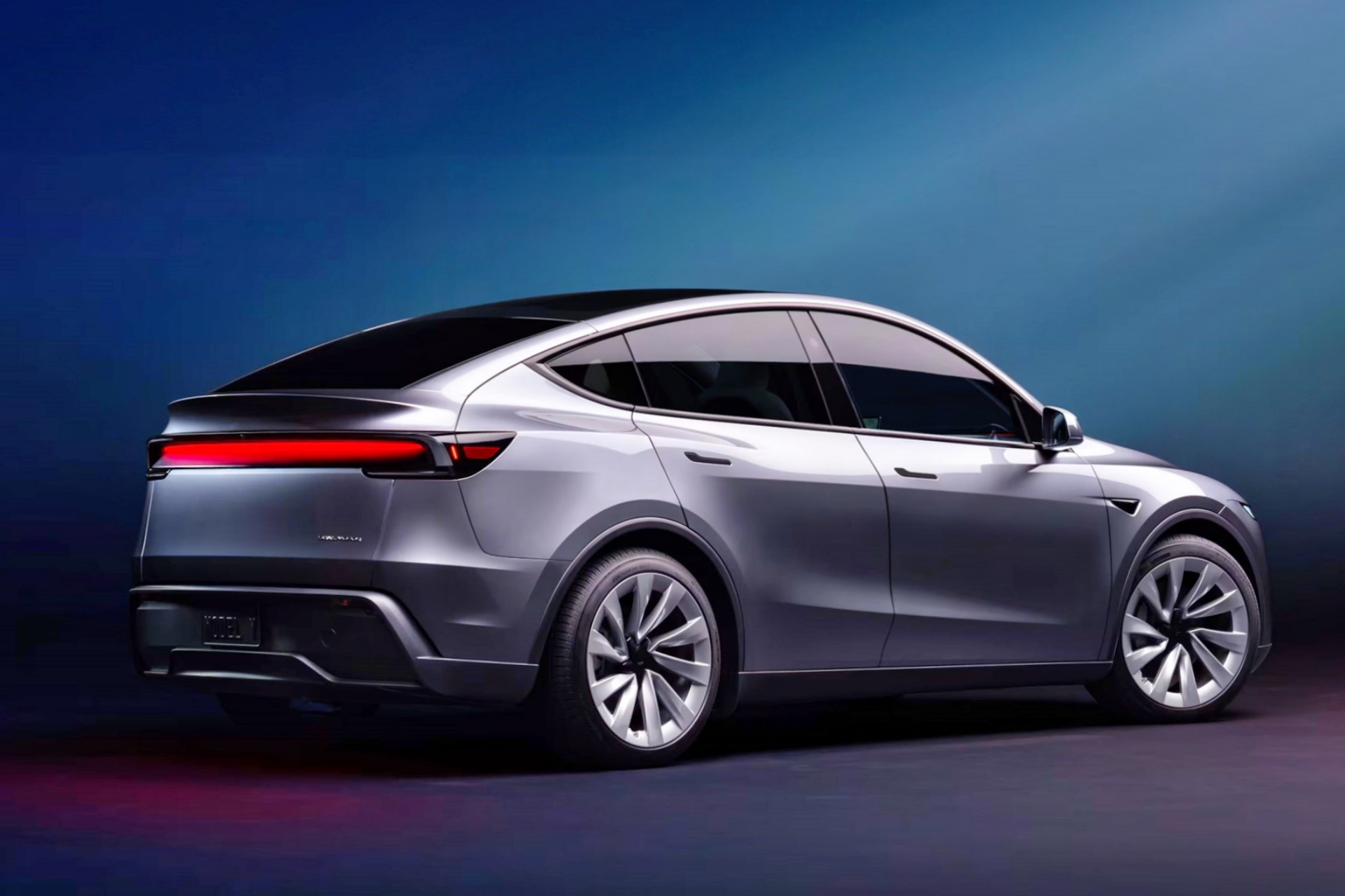 Vista lateral y trasera del Tesla Model Y 2025, destacando su diseño aerodinámico.