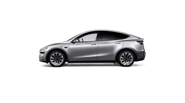 Vista lateral del Tesla Model Y 2025, destacando su diseño aerodinámico.