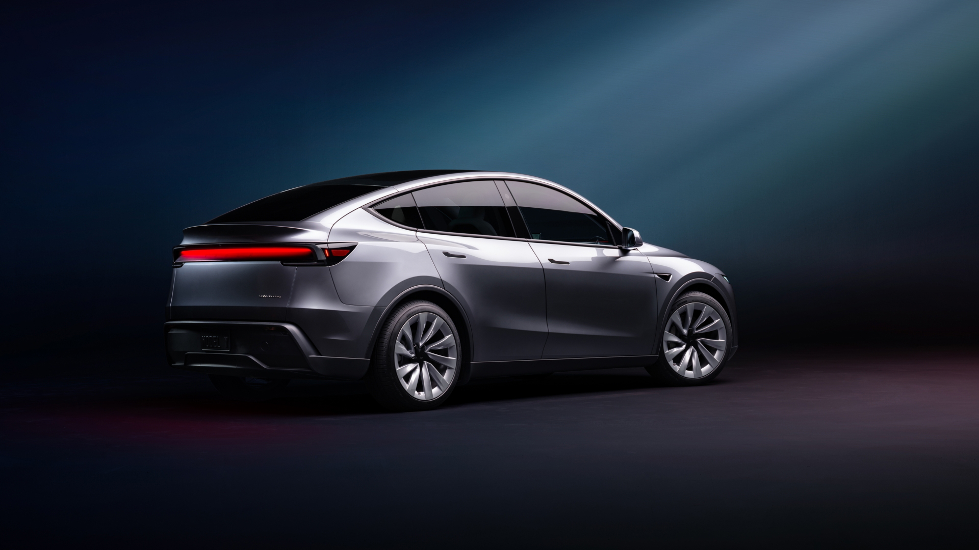 Vista del Tesla Model Y 2025, mostrando su diseño contemporáneo y aerodinámico.