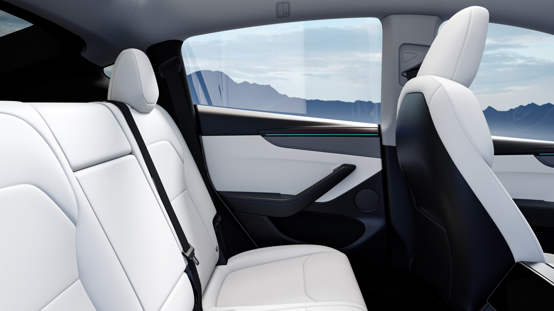 Vista del interior trasero del Tesla Model Y, destaca su diseño minimalista y asientos espaciosos.