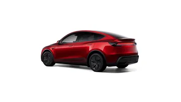 Vista lateral y trasera del Tesla Model Y 2025 en un atractivo color rojo.