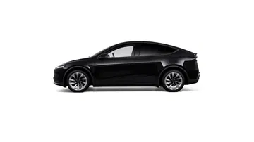 Vista lateral del Tesla Model Y 2025, destacando su elegante diseño y formas aerodinámicas.