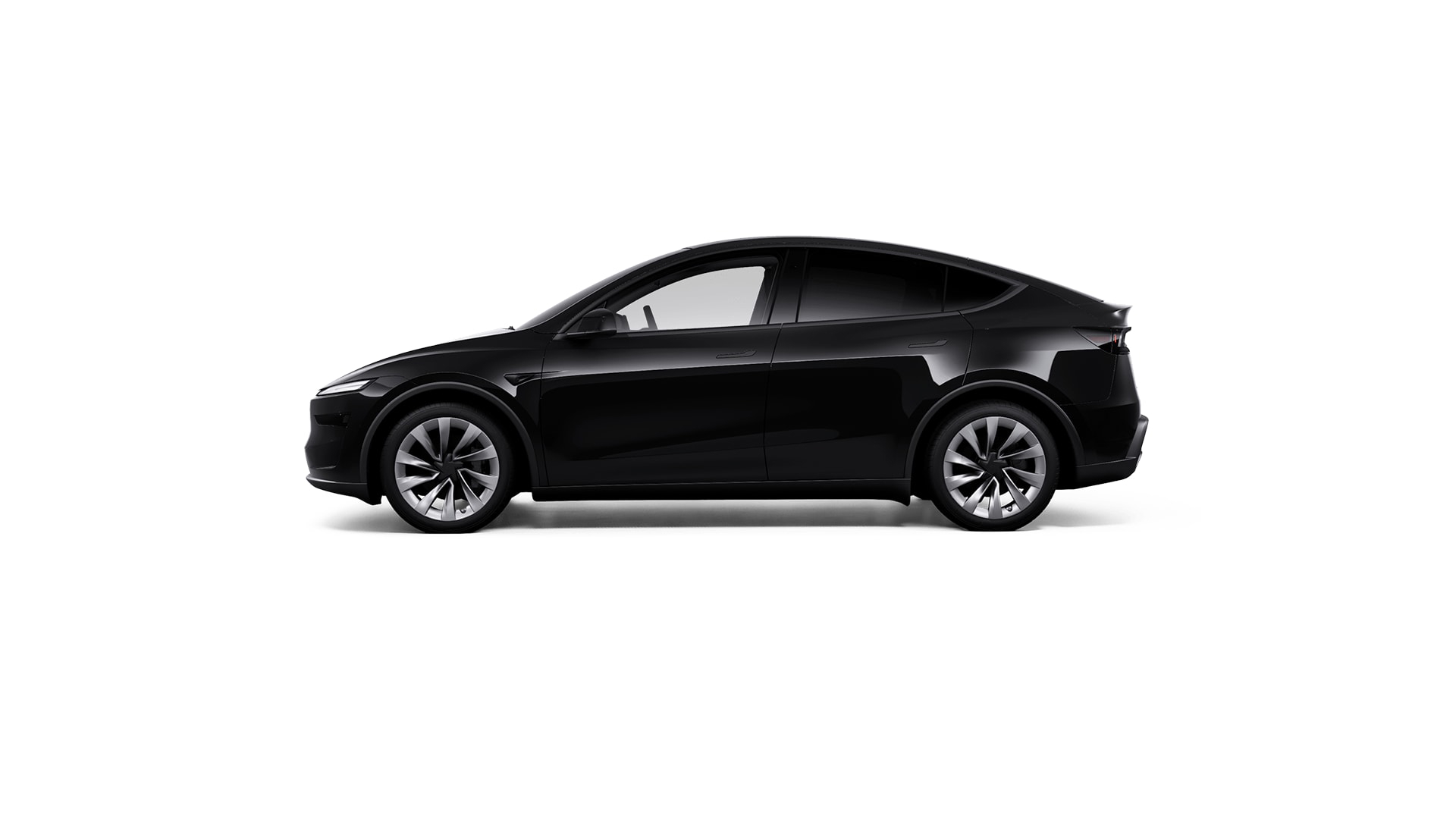 Vista lateral del Tesla Model Y 2025, destacando su elegante diseño y formas aerodinámicas.