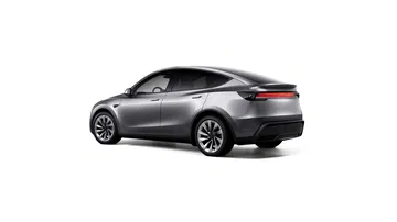 Vista lateral y trasera del Tesla Model Y 2025, resaltando su diseño futurista.