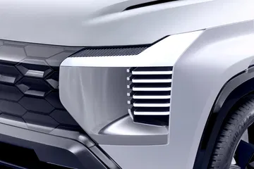 Vista lateral del Mitsubishi DST Concept, destacando su diseño moderno y agresivo.
