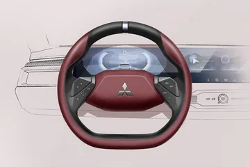 Volante del Mitsubishi DST, con diseño futurista y elegante, ideal para un SUV de aventura.