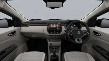 Vista del interior del Renault Triber, con asientos cómodos y tecnología intuitiva.