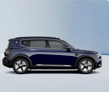 Vista lateral del SUV Smart, diseño moderno y funcional. Vista lateral del SUV Smart, diseño moderno y funcional.
