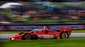 Coche de Will Power, Team Penske en acción durante una carrera emocionante
